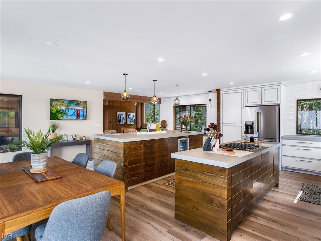 751 Champagne Road Incline Village, NV 89451 - Photo 10 of 30 a kitchen with a sink stove and wooden cabinets