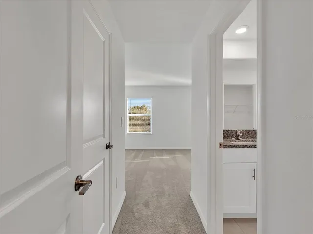 a bathroom with a granite countertop sink mirror and shower