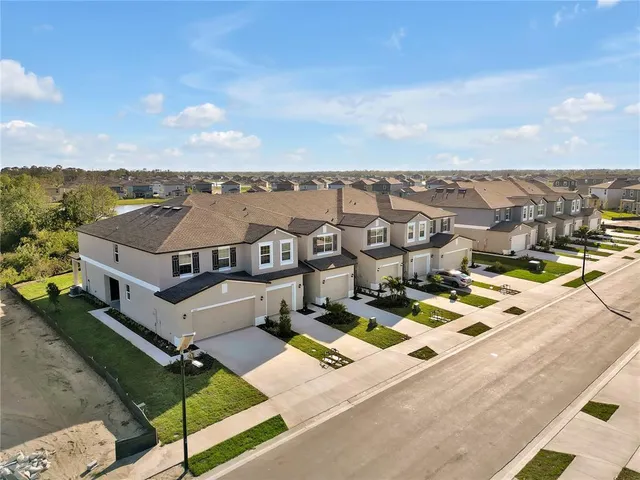 an aerial view of a house with a ocean view