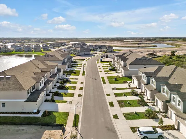 an aerial view of a house with a ocean view