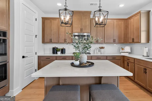 a kitchen with cabinets and white appliances