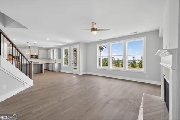 a view of a dining room with furniture and window