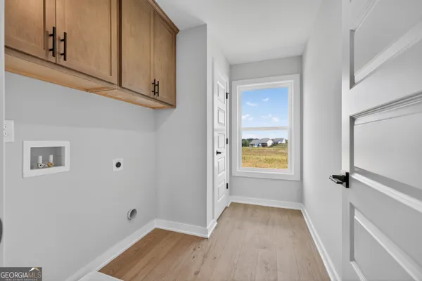 a bathroom with a granite countertop sink a toilet a mirror and shower