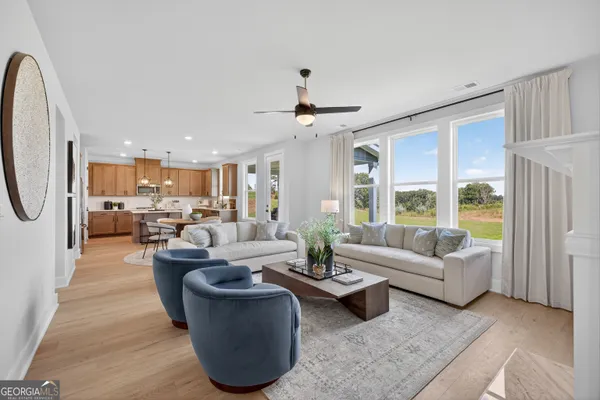 a living room with furniture and a large window