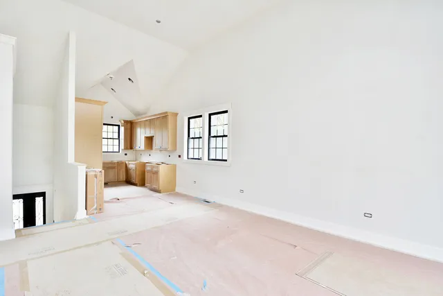 an entryway with a bed and a mirror