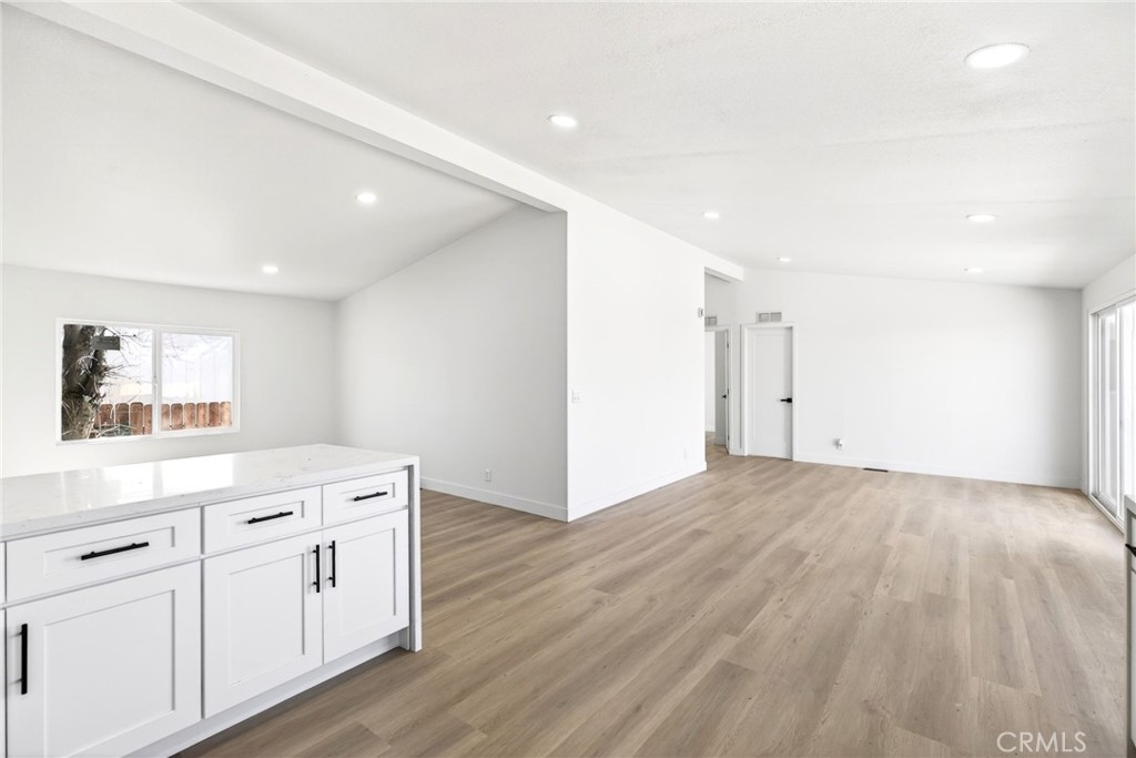 80 East Dawes Street, Unit 126 Perris, CA 92571 - Photo 15 of 39 a view of a kitchen with white cabinets