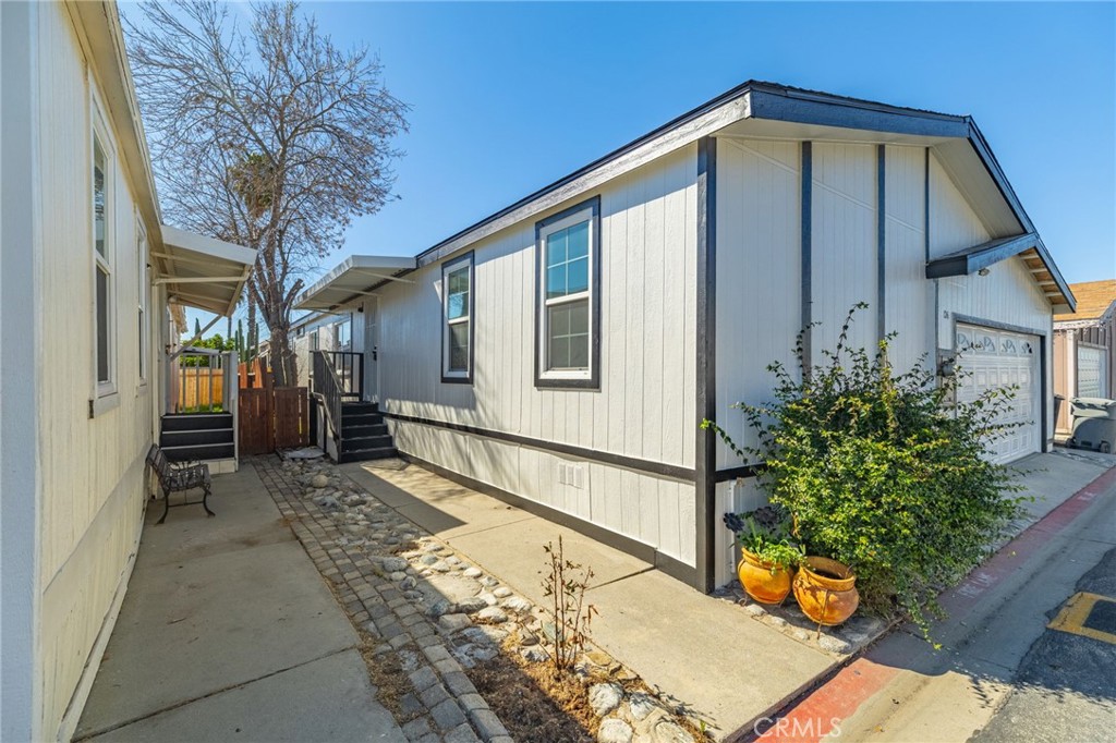 80 East Dawes Street, Unit 126 Perris, CA 92571 - Photo 29 of 39 a view of a house with a small yard