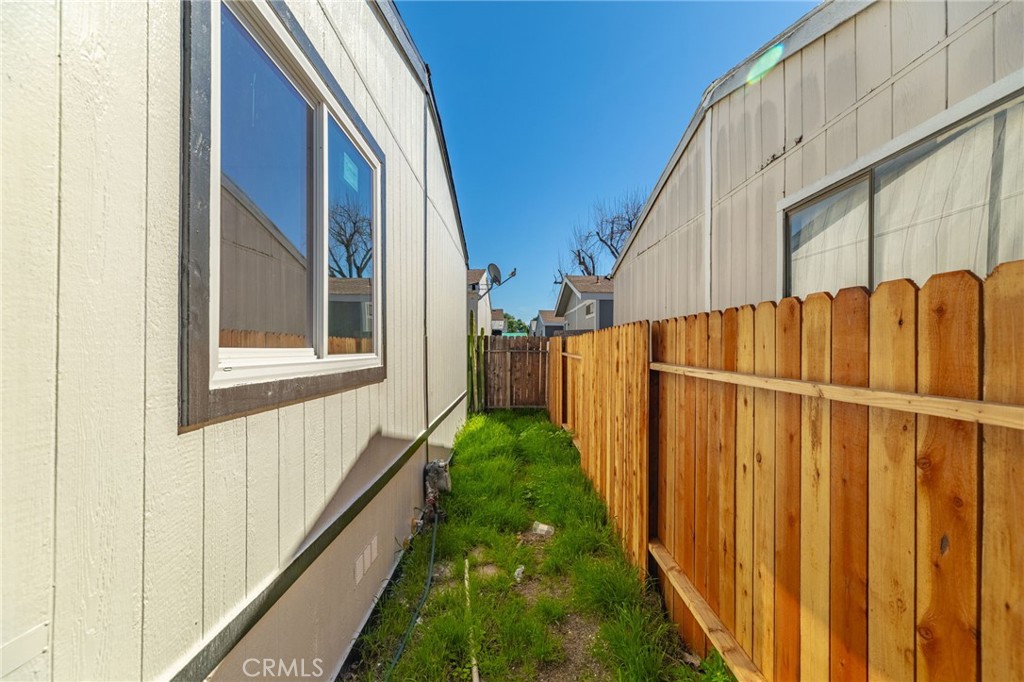 80 East Dawes Street, Unit 126 Perris, CA 92571 - Photo 32 of 39 a view of a house with a yard
