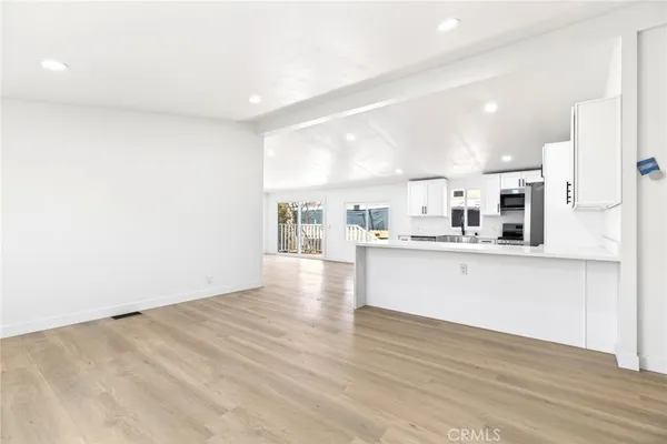 a view of kitchen with wooden floor