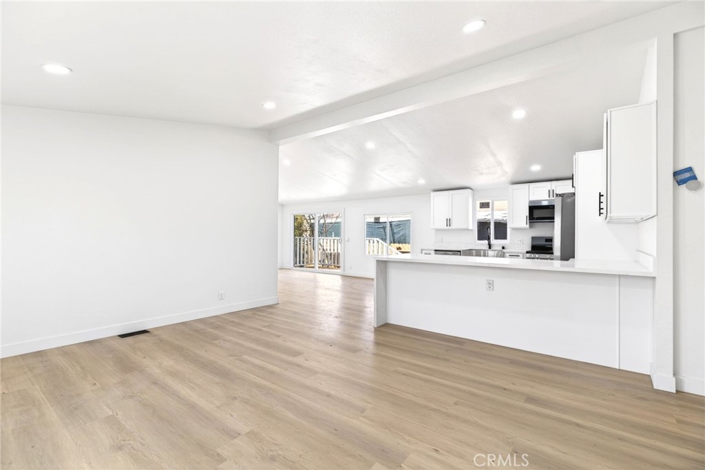 80 East Dawes Street, Unit 126 Perris, CA 92571 - Photo 4 of 39 a view of kitchen with wooden floor