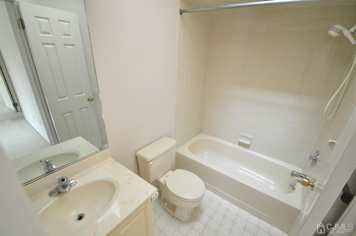 502 Timber Oaks Road Edison, NJ 08820 - Photo 10 of 21 a bathroom with a sink toilet and shower
