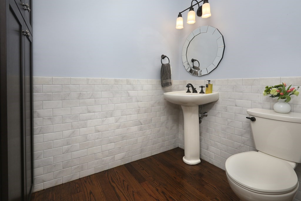 3 Magnolia Road Natick, MA 01760 - Photo 17 of 35 a bathroom with a toilet a sink and mirror