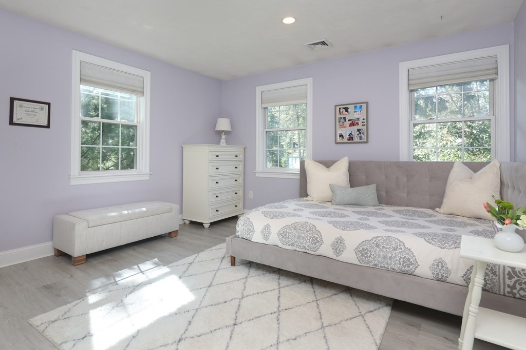 3 Magnolia Road Natick, MA 01760 - Photo 21 of 35 a bedroom with a bed and a dresser
