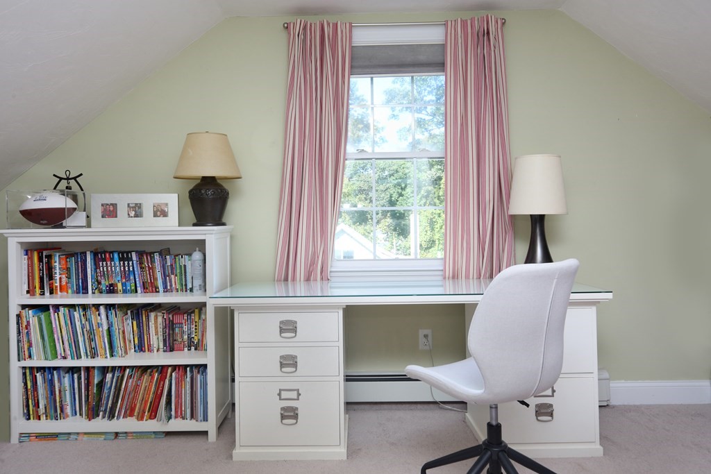 3 Magnolia Road Natick, MA 01760 - Photo 27 of 35 a view of a workspace with a bookshelf