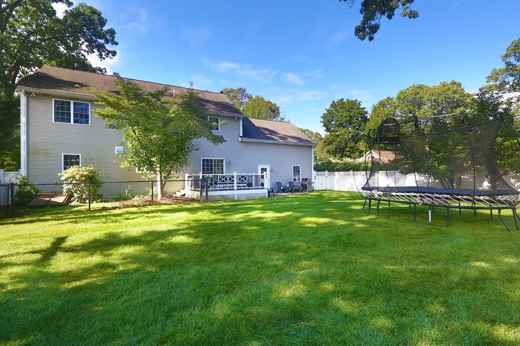 3 Magnolia Road Natick, MA 01760 - Photo 34 of 35 a front view of a house with a garden