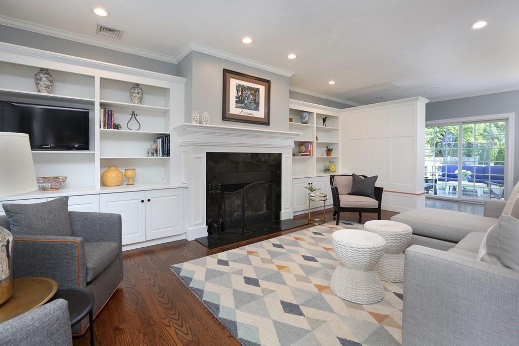 3 Magnolia Road Natick, MA 01760 - Photo 5 of 35 a living room with furniture and a fireplace