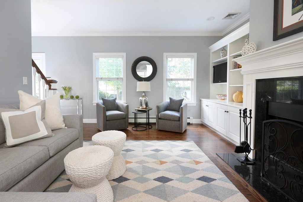 3 Magnolia Road Natick, MA 01760 - Photo 7 of 35 a living room with furniture and a fireplace