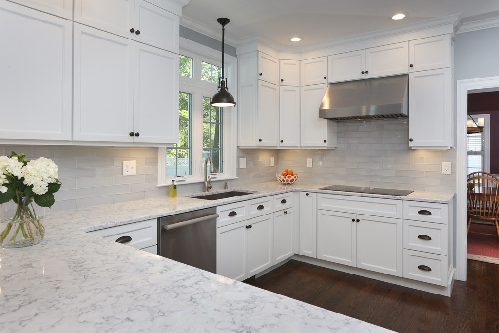 3 Magnolia Road Natick, MA 01760 - Photo 9 of 35 a kitchen with granite countertop white cabinets and white appliances