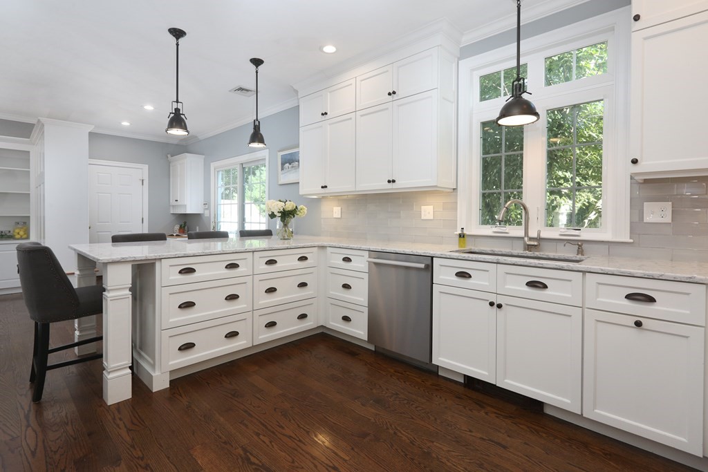 3 Magnolia Road Natick, MA 01760 - Photo 10 of 35 a kitchen with granite countertop a sink cabinets and wooden floor