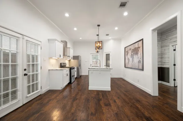 a view of kitchen with cabinets and wooden floor