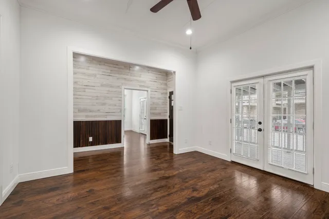 wooden floor in an empty room with a fireplace
