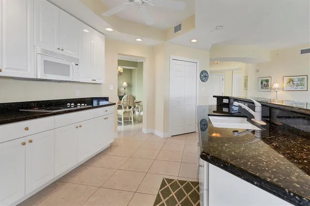 a bathroom with a bathtub a double vanity sink and a mirror