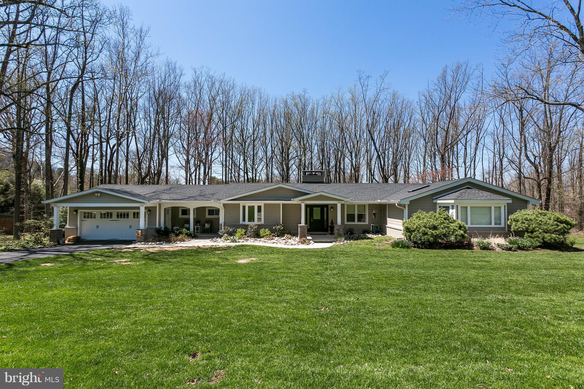 1310 Milldam Road Baltimore, MD 21286 - Photo 1 of 29 a front view of a house with a garden