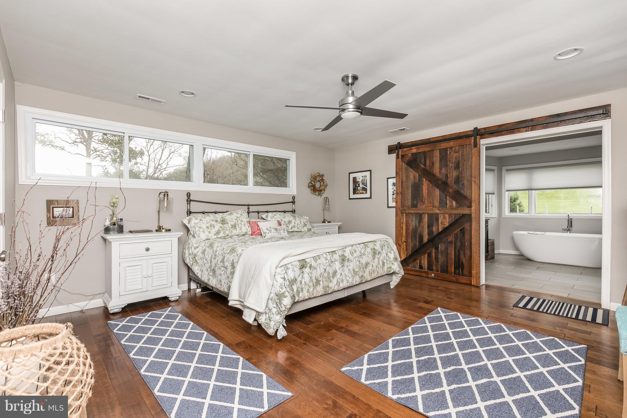 1310 Milldam Road Baltimore, MD 21286 - Photo 13 of 29 a bedroom with a large bed and a window
