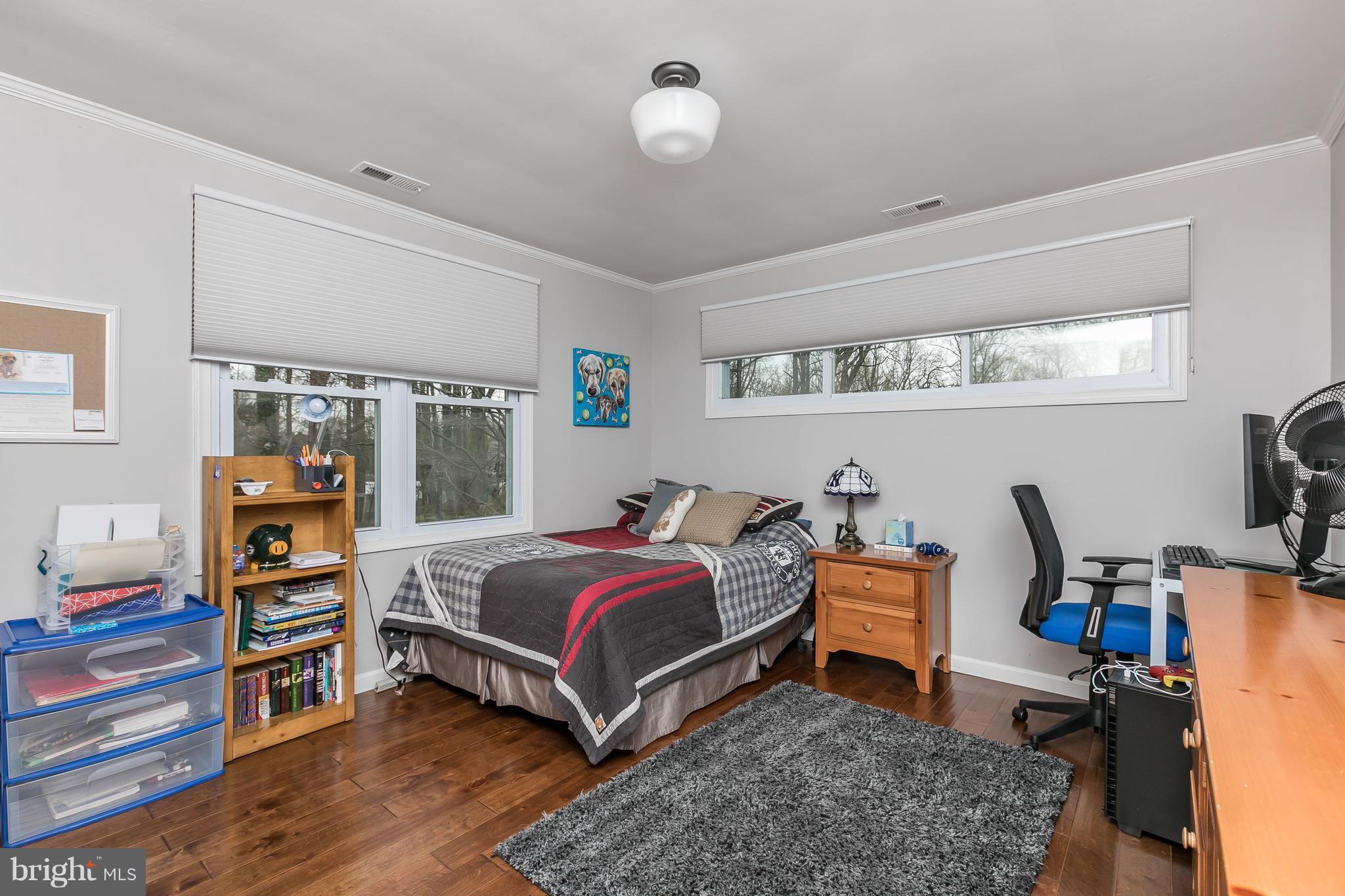 1310 Milldam Road Baltimore, MD 21286 - Photo 16 of 29 a bed room with a bed and a desk