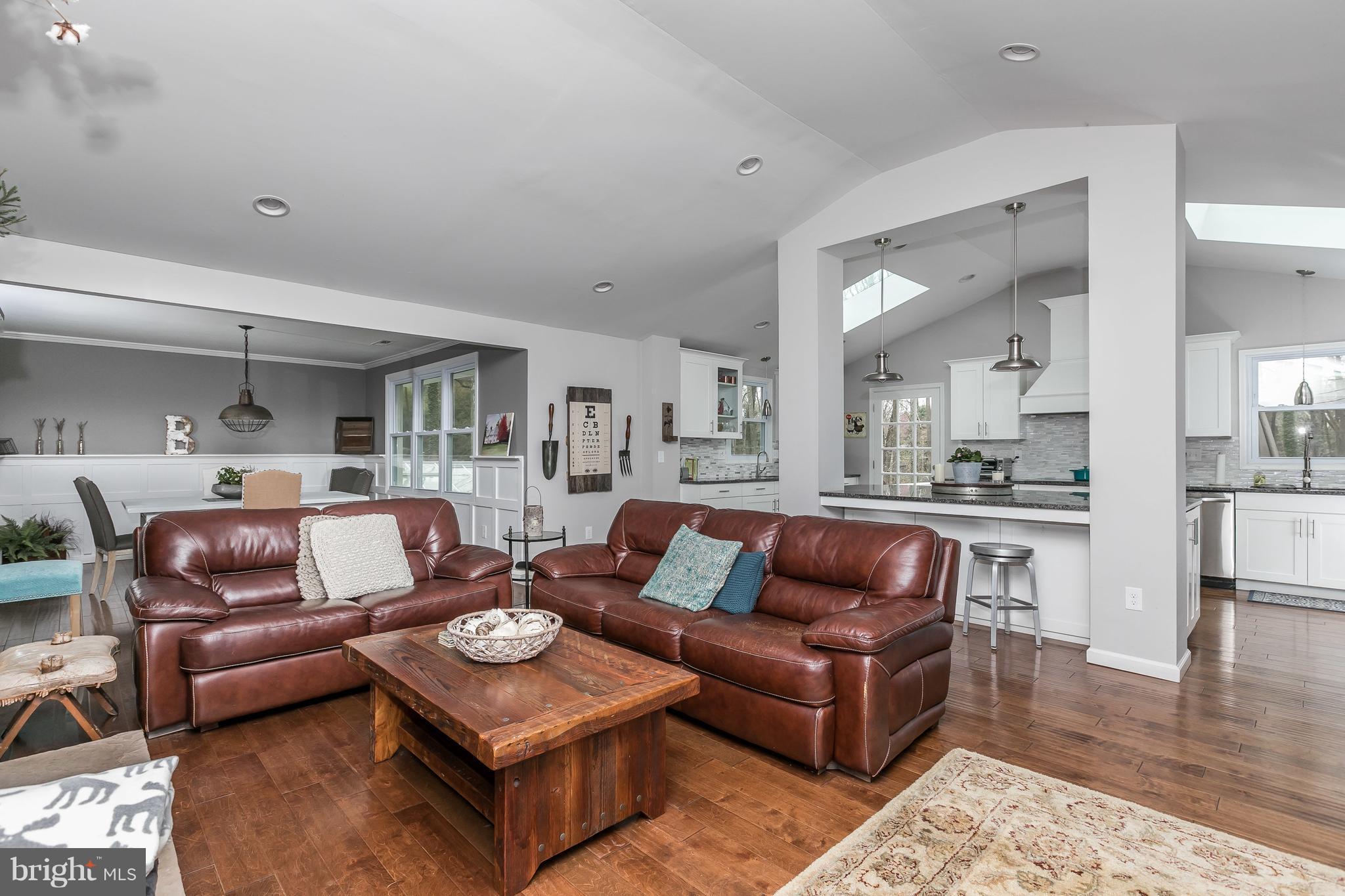 1310 Milldam Road Baltimore, MD 21286 - Photo 7 of 29 a living room with furniture and a view of kitchen