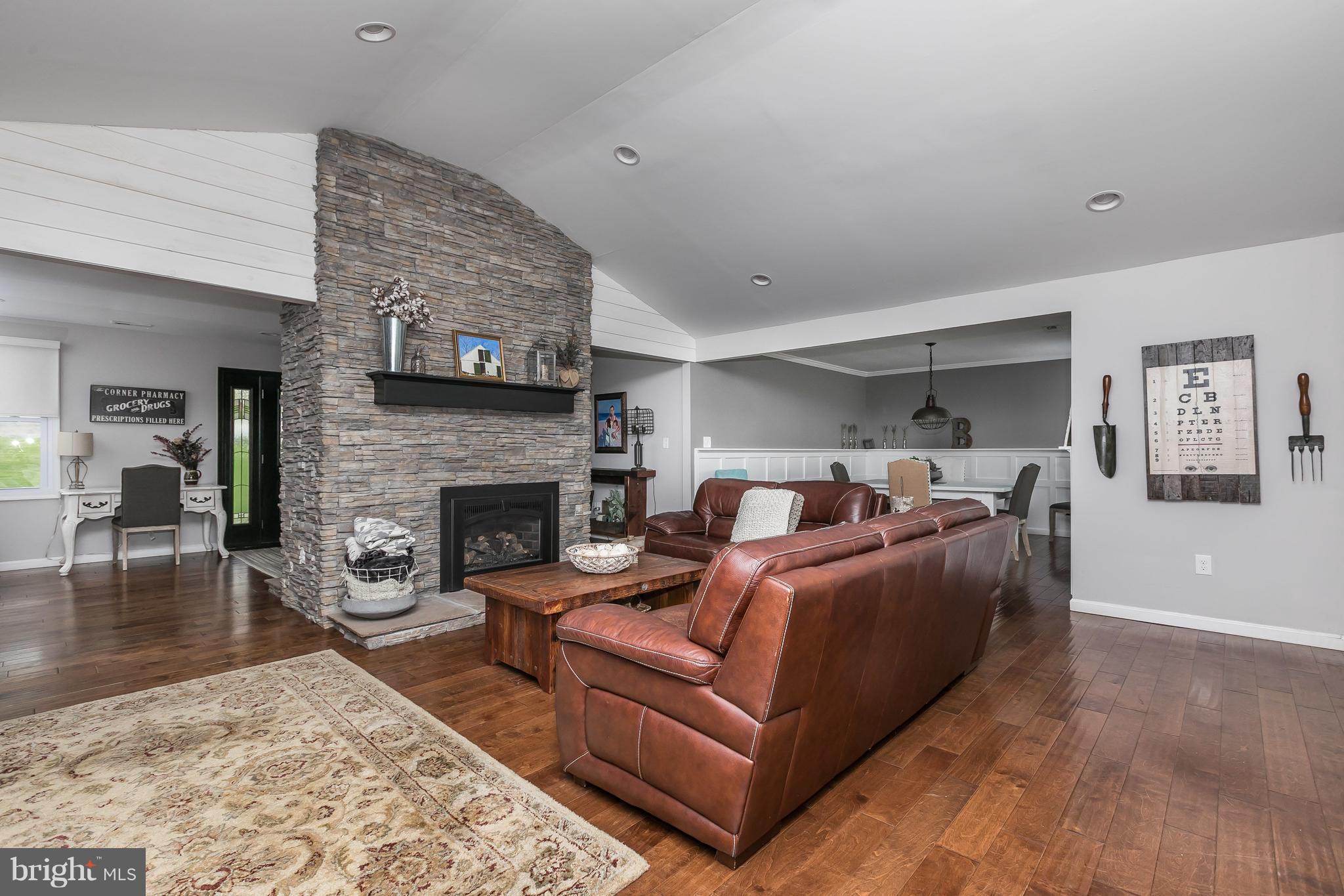 1310 Milldam Road Baltimore, MD 21286 - Photo 8 of 29 a living room with furniture and a fireplace