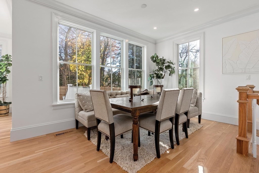 15 Sterling Street Newton, MA 02465 - Photo 17 of 39 a view of a dining room with furniture window and wooden floor