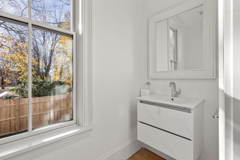 15 Sterling Street Newton, MA 02465 - Photo 19 of 39 a bathroom with a sink and a mirror