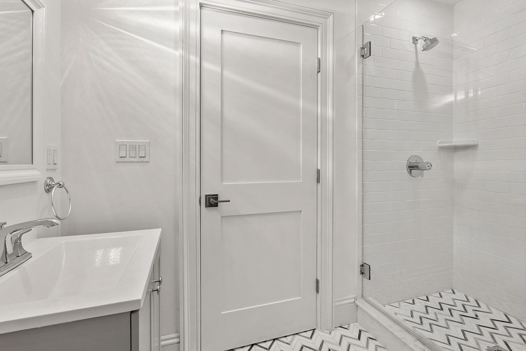 15 Sterling Street Newton, MA 02465 - Photo 27 of 39 a bathroom with a shower and a sink