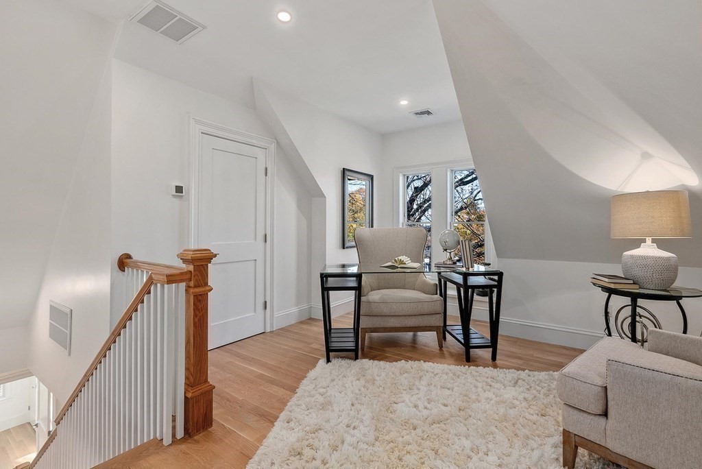 15 Sterling Street Newton, MA 02465 - Photo 28 of 39 a view of a livingroom with furniture and stairs