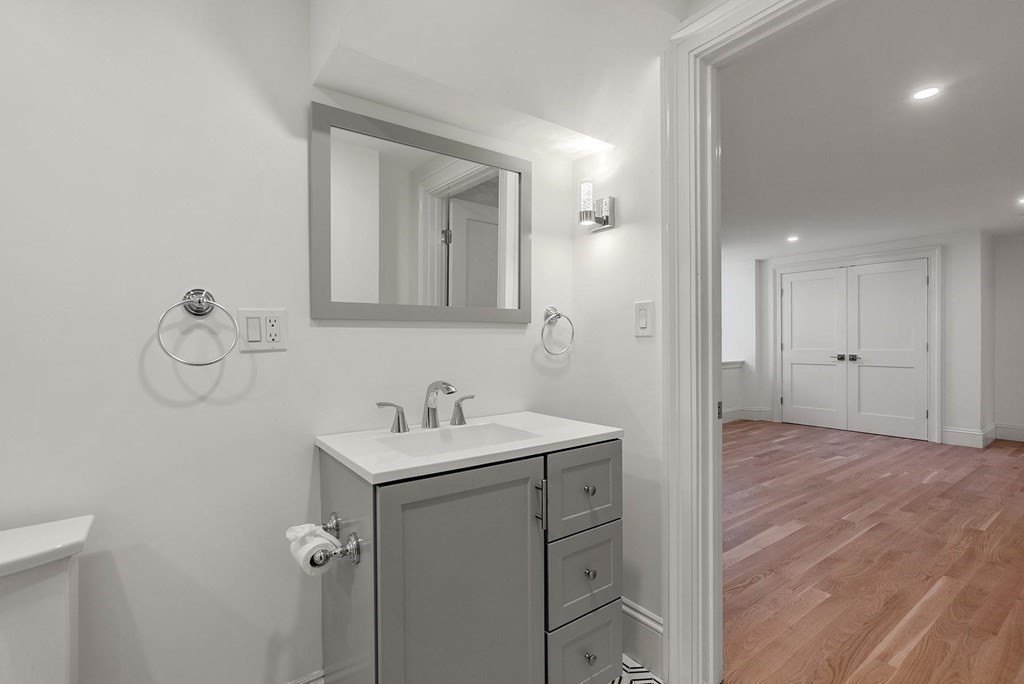15 Sterling Street Newton, MA 02465 - Photo 33 of 39 a bathroom with a sink and a mirror