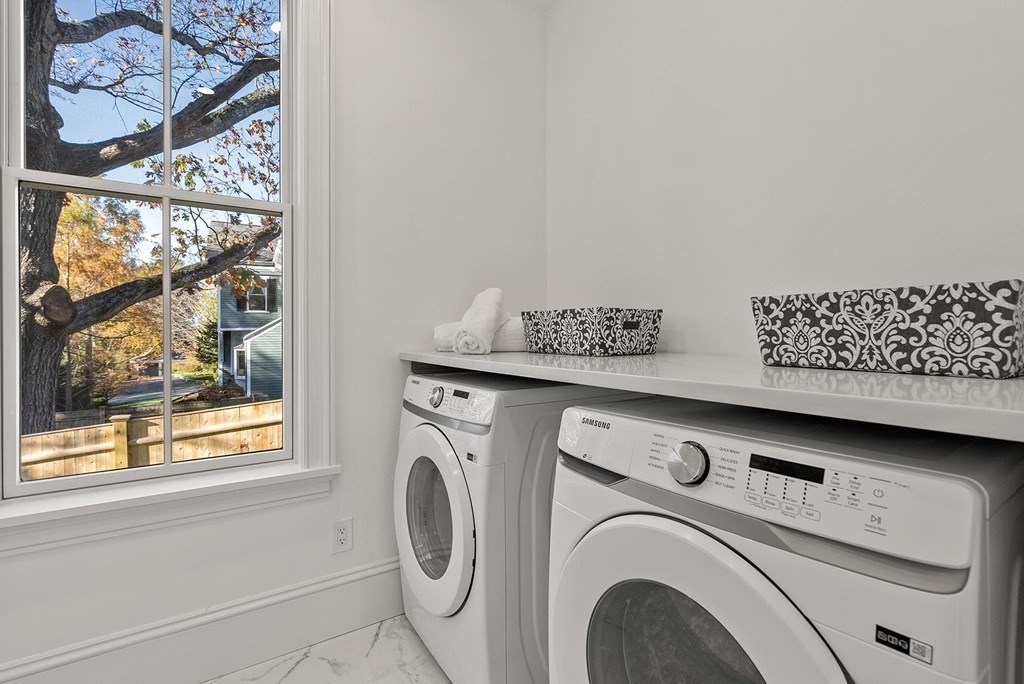15 Sterling Street Newton, MA 02465 - Photo 34 of 39 a utility room with dryer and washer