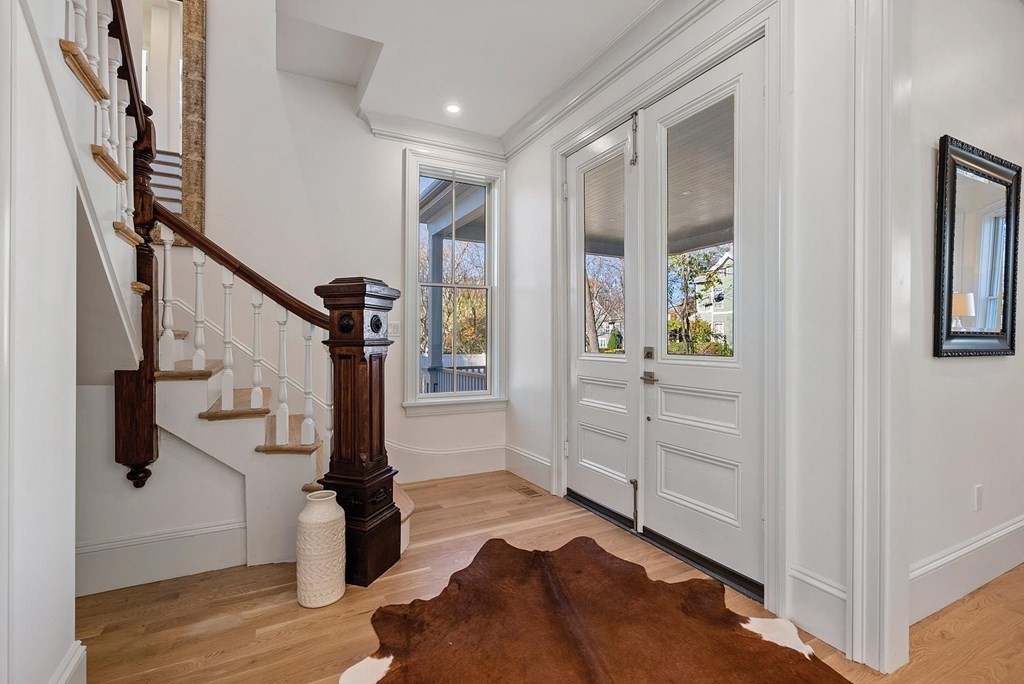 15 Sterling Street Newton, MA 02465 - Photo 4 of 39 a view of entryway with wooden floor and stairs