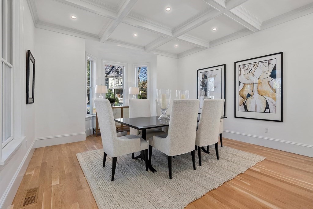 15 Sterling Street Newton, MA 02465 - Photo 9 of 39 a view of a dining room with furniture and wooden floor