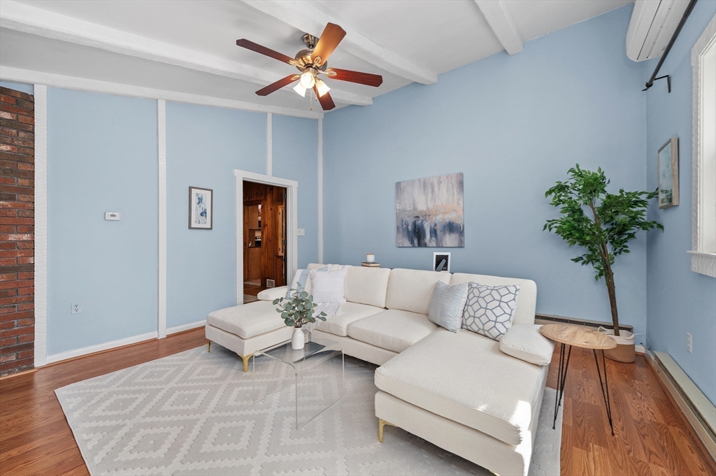 10 Parker Road Newton, MA 02459 - Photo 7 of 27 a living room with furniture and a potted plant