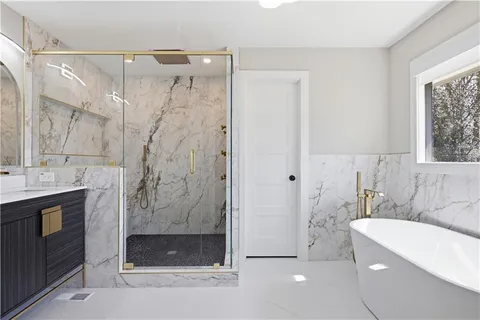a bathroom with a double vanity sink and a mirror
