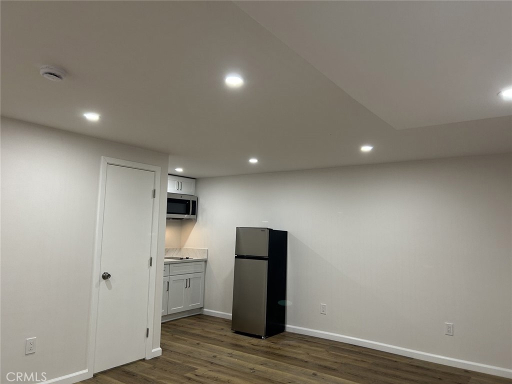 127 North Canyon Boulevard Monrovia, CA 91016 - Photo 5 of 8 a view of a kitchen with a refrigerator and a stove