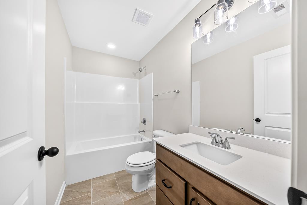 6 Liberty Place Fort Mitchell, AL 36856 - Photo 25 of 27 a bathroom with a sink a toilet and shower