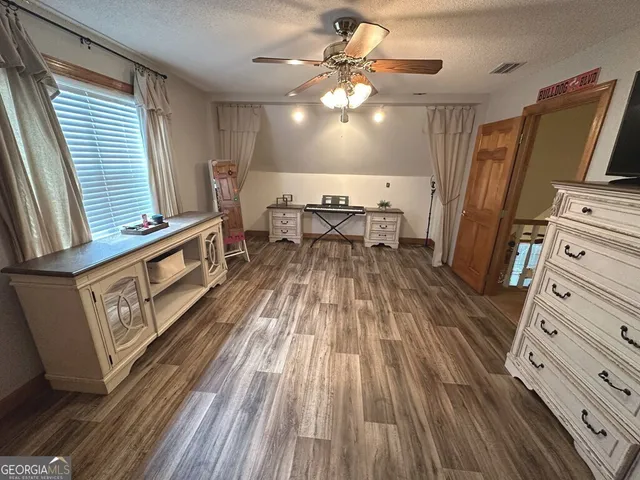 a view of a room with furniture window and wooden floor