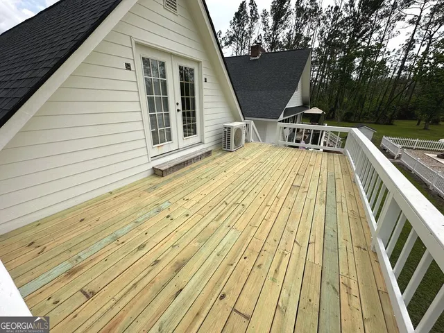 a view of a backyard with swimming pool