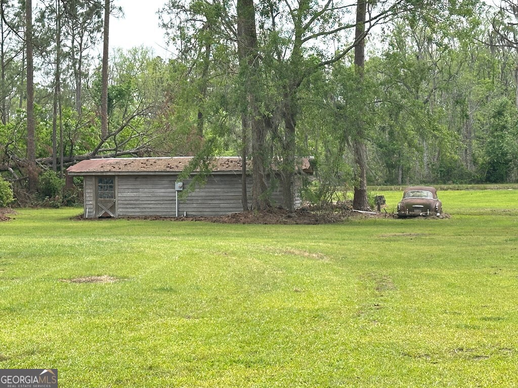 4448 Old Lake Park Road Valdosta, GA 31606 - Photo 28 of 40 a view of a backyard with swimming pool