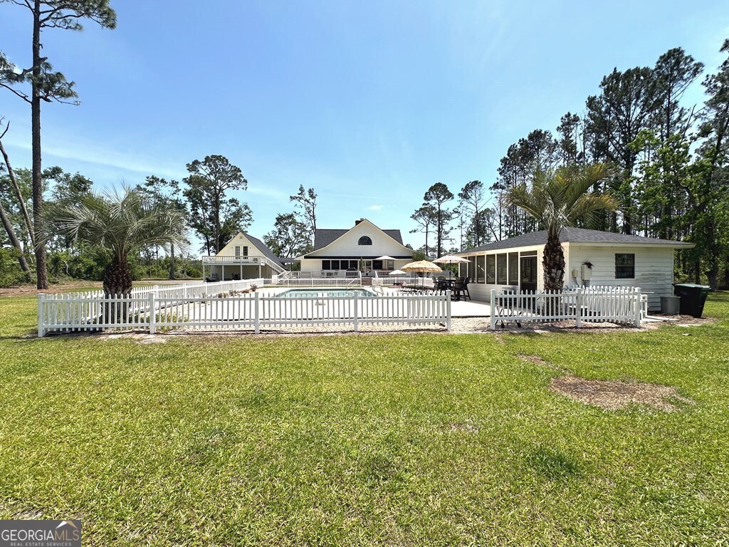4448 Old Lake Park Road Valdosta, GA 31606 - Photo 37 of 40 a house view with swimming pool in front of it