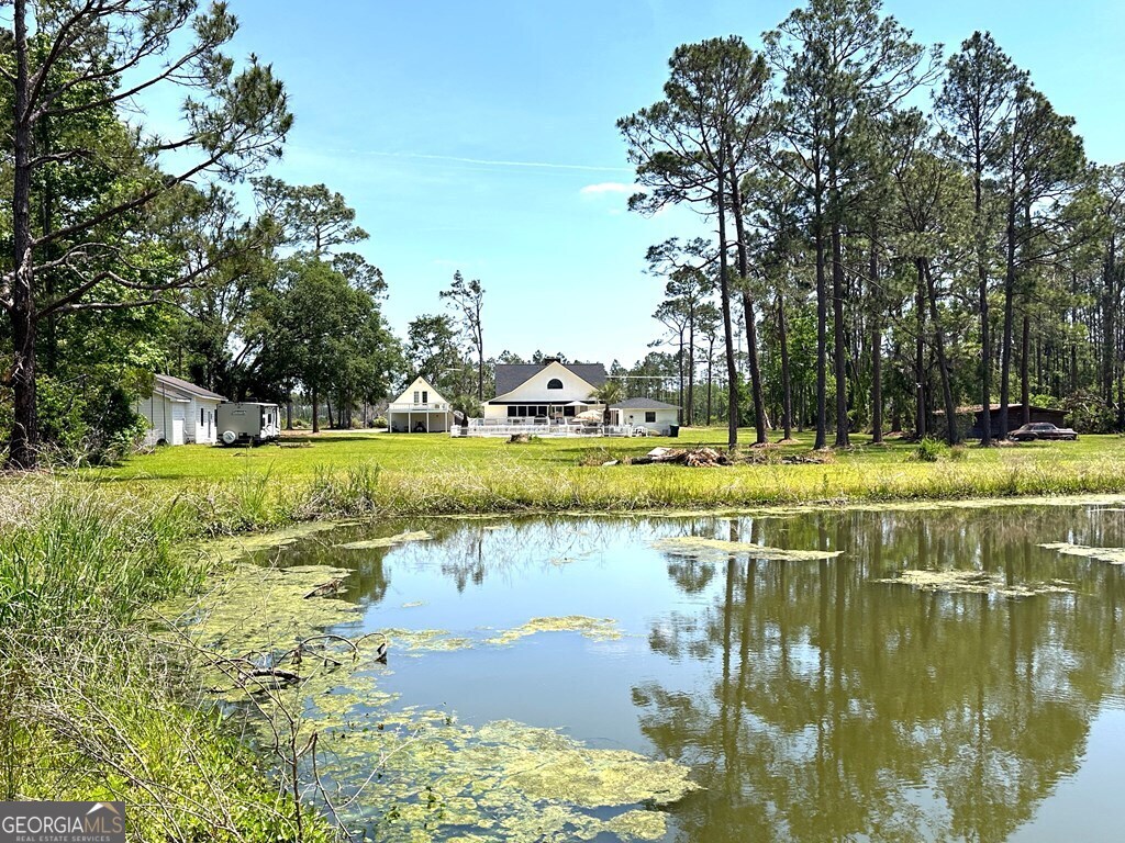 4448 Old Lake Park Road Valdosta, GA 31606 - Photo 39 of 40 a view of a lake with houses