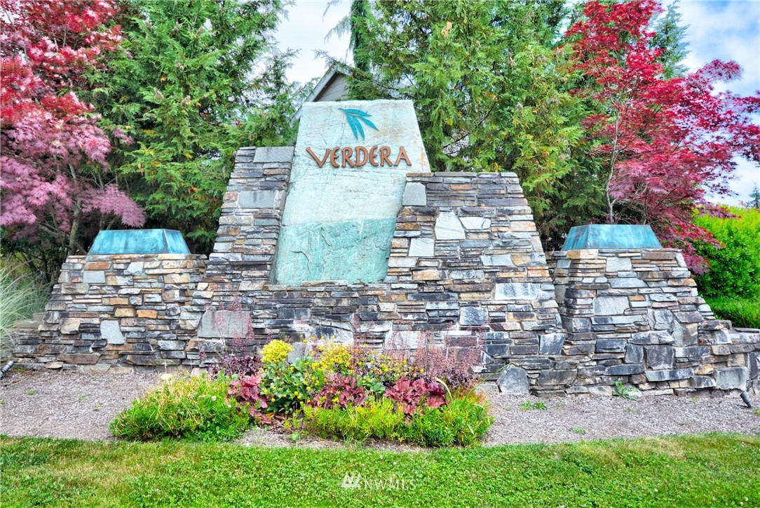16229 35th Park Southeast Bothell, WA 98012 - Photo 2 of 23 a front view of a house with a yard and fountain in middle