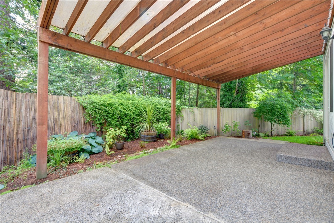 16229 35th Park Southeast Bothell, WA 98012 - Photo 20 of 23 a backyard of a house with a patio table and chairs